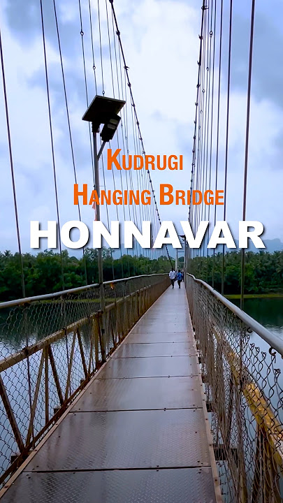 Walking on Kudrugi bridge Honnavar during the river backwater tour